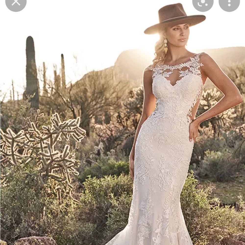 This brand new, never worn wedding dress is an absolute steal! Originally $1625